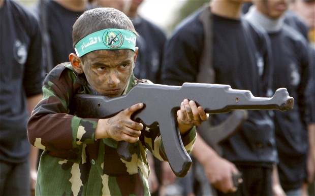 A Palestinian boy takes part in military training organized by the Hamas education ministry in Gaza City